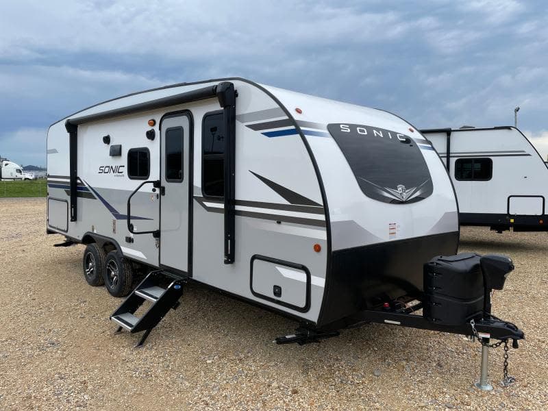 This silver and white Sonic travel trailer is perfect for your next rv rental adventure. Ready for camping!